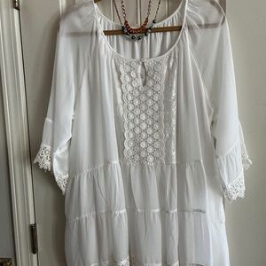 White soft flows top. Will look good with black or bright colored slacks